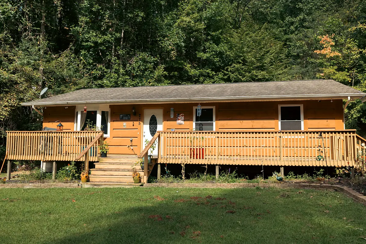 When to replace siding: weathered wood siding on a ranch home