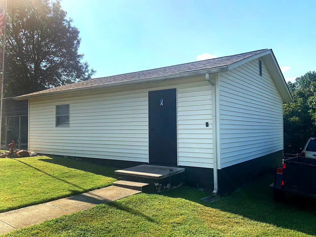 Before: old white siding on a Knoxville home on Dogwood Road