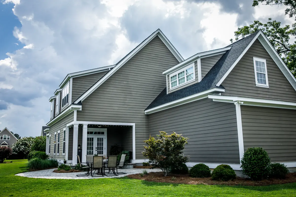 Two-story home with gray siding and white trim