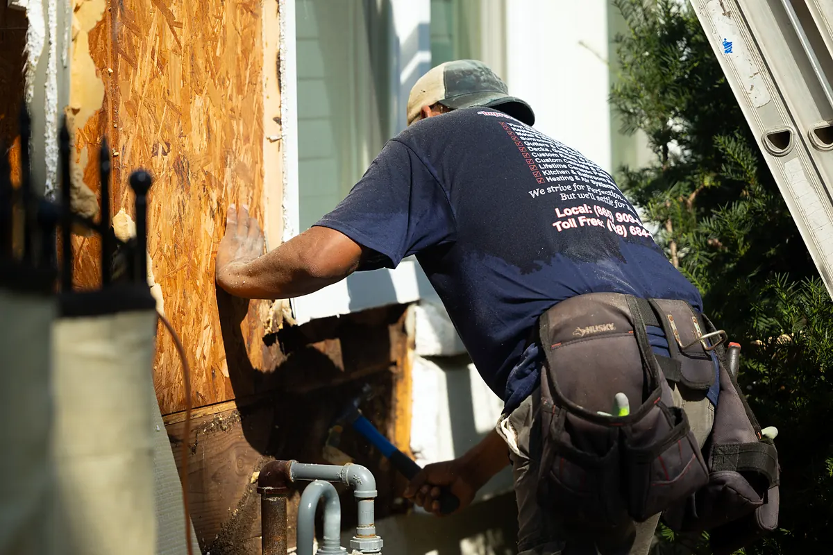 Signs your siding needs replacing: rotted sheathing found behind old siding
