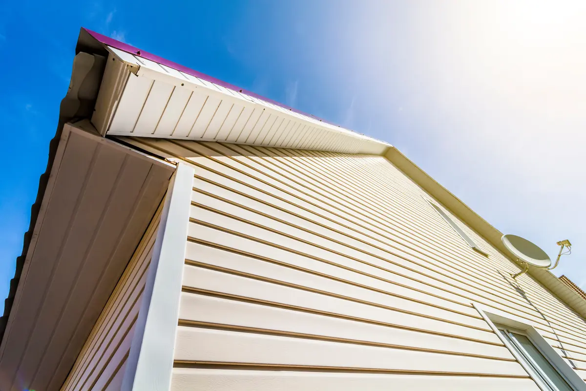Vinyl siding and soffit along a roofline